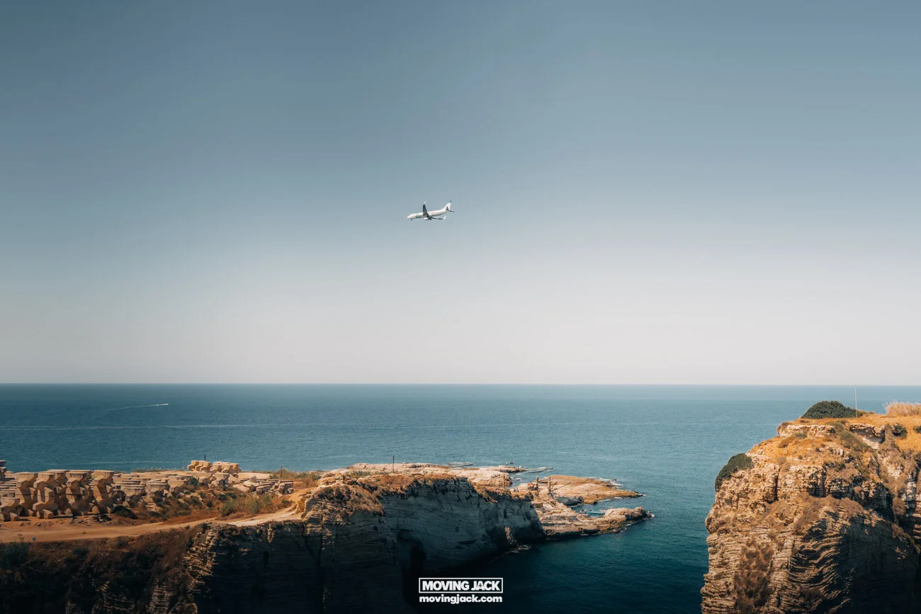 A long-haul flight flying over the ocean.