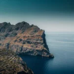 A rocky cliff overlooking the ocean.