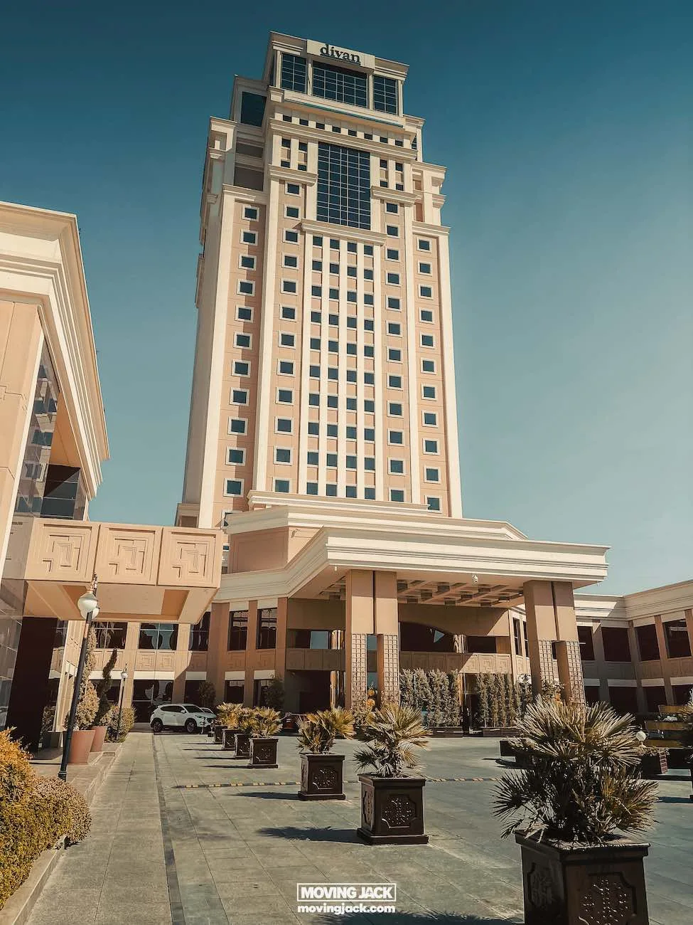 Visiting erbil & iraq for the first time: expert guide + tips 12 first time Tall hotel building with a modern design, perfect for first-timers, features numerous windows and a prominent entrance. Landscaping with potted plants lines the paved pathway leading to the entrance. -copyright-moving-jack. Com