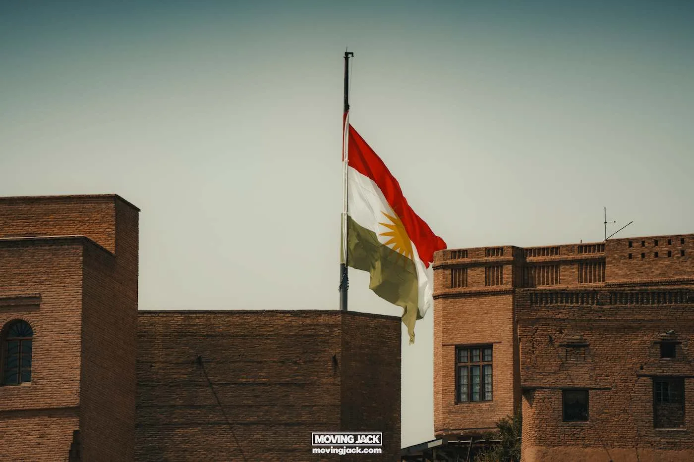 Visiting erbil & iraq for the first time: expert guide + tips 4 first time For first-timers exploring the region, the sight of the kurdistan flag unfurling gracefully on a pole between two brick buildings against a clear sky is truly captivating. -copyright-moving-jack. Com