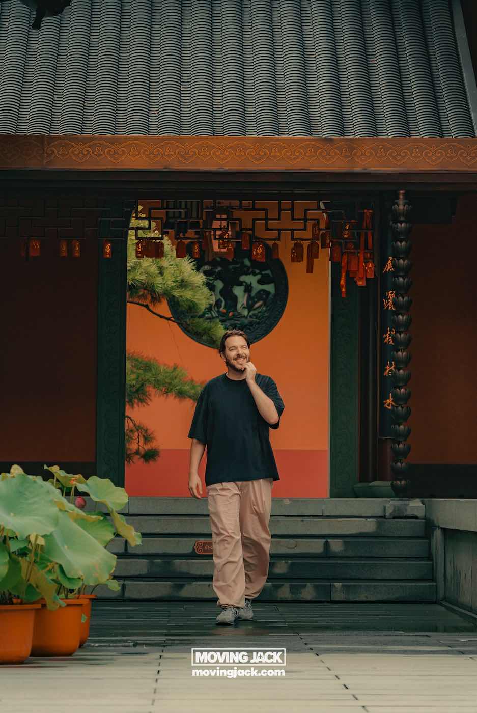 57 things to do in shanghai: the ultimate handbook 50 things to do in shanghai A man in casual clothing walks and laughs in front of a traditional building with lanterns and potted plants in shanghai's french concession, capturing the lively charm and european-style architecture that make neighborhood wandering among the delightful things to do in shanghai. -copyright-moving-jack. Com