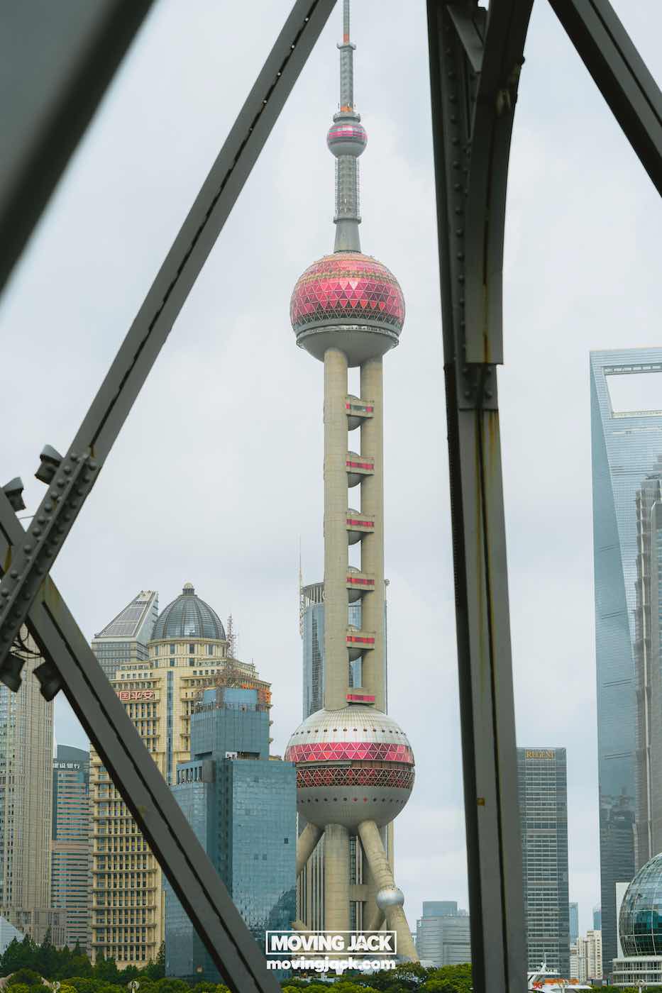 15 unique things to do in shanghai near the bund 7 things to do in shanghai near the bund The oriental pearl tower in shanghai, china, is seen framed through the structure of a metal bridge, with surrounding modern skyscrapers in the background. -copyright-moving-jack. Com