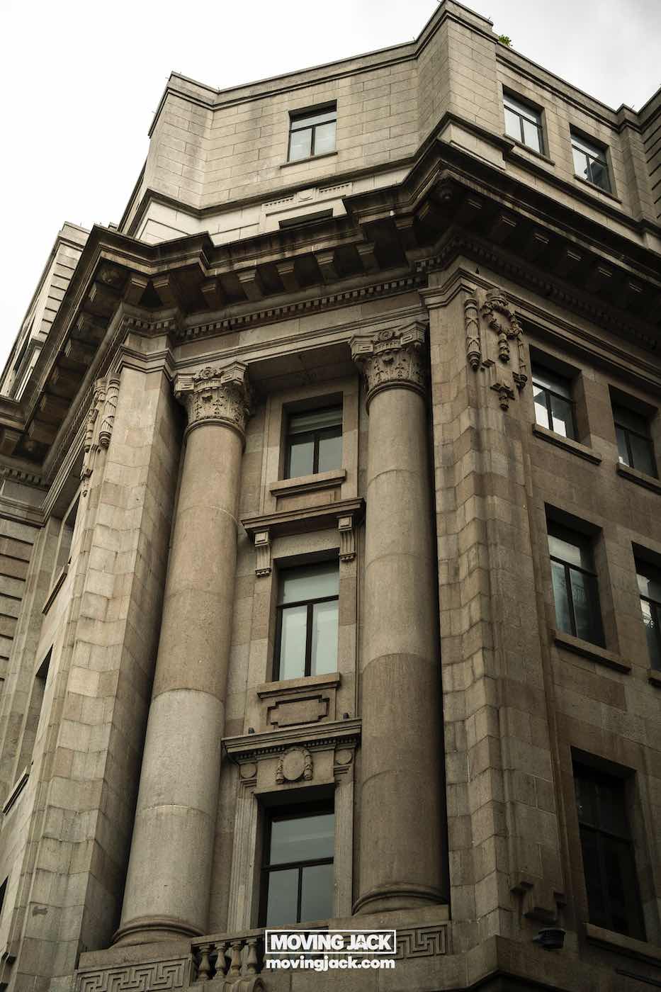 15 unique things to do in shanghai near the bund 9 things to do in shanghai near the bund A stone building with classical architectural elements, including columns, decorative molding, and rectangular windows. -copyright-moving-jack. Com