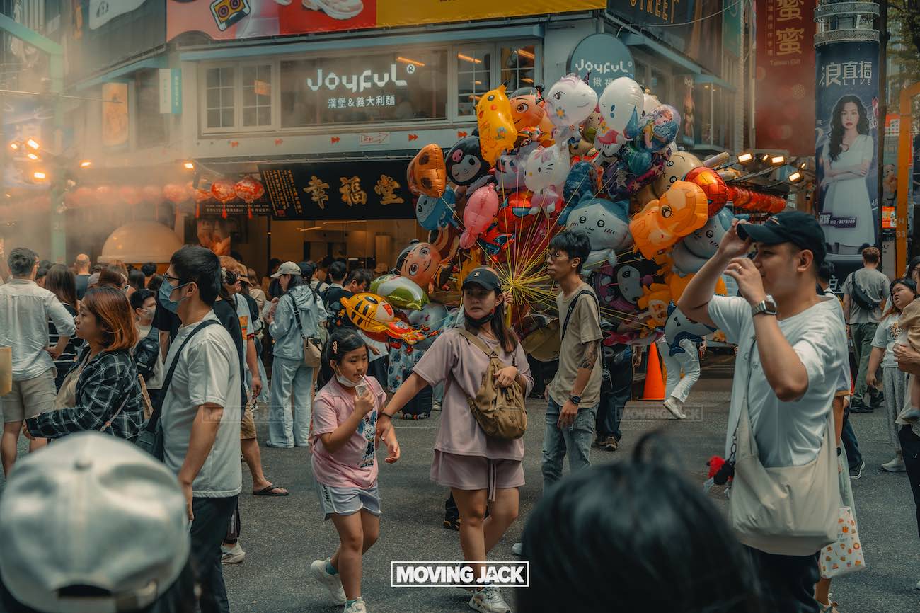 20+ best things to do in taipei (by an expert) 32 things to do in taipei A crowded city street scene with people walking, a street vendor selling colorful balloons, and mist in the background—capturing the lively urban atmosphere and some of the best things to do in taipei amidst bright shop signs and bustling buildings. -copyright-moving-jack. Com