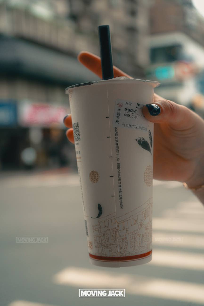 20+ best things to do in taipei (by an expert) 30 things to do in taipei A hand with black-painted nails holds a bubble tea cup with a black straw. The cup has asian writing and a cityscape design. The background is blurred, showing an urban street scene in daylight. -copyright-moving-jack. Com