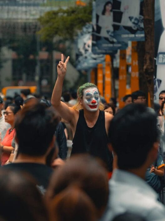 20+ best things to do in taipei 44 renting a car in okinawa A man standing in the crowd performing his arts in taipei.