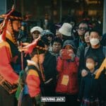 31 best free & cheap things to do in seoul (by an expert) 3 ikseon dong A crowd enjoys a traditional cultural parade—one of the free things to do in seoul—with two people in colorful historical costumes. Some spectators wear masks, while another records the vibrant scene with a red phone. -copyright-moving-jack. Com