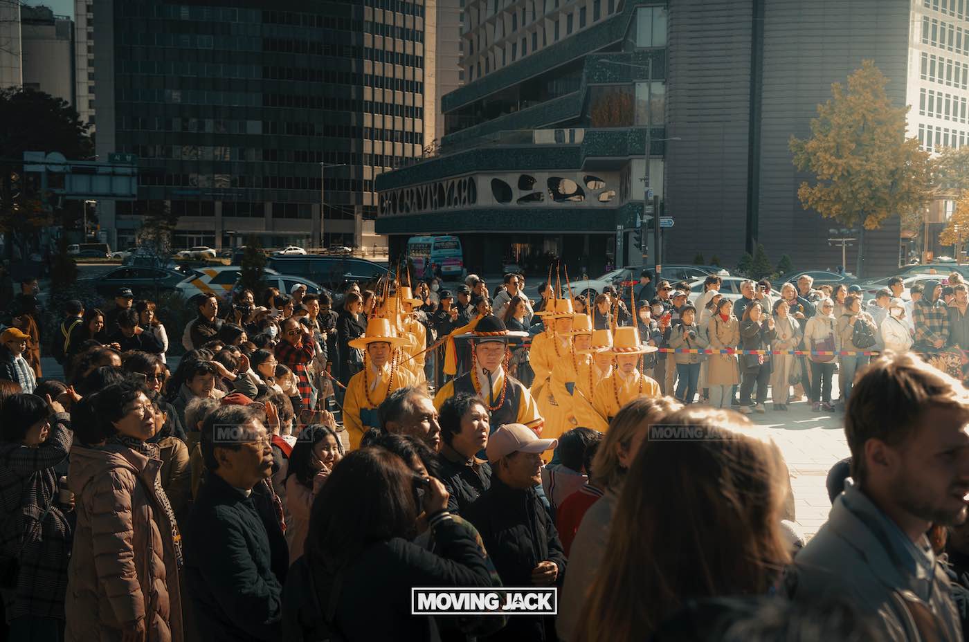 31 best free & cheap things to do in seoul (by an expert) 8 free things to do in seoul A crowd observes a group of people in traditional yellow costumes and hats during an outdoor event in seoul, surrounded by tall buildings—one of the vibrant free things to do in seoul. -copyright-moving-jack. Com