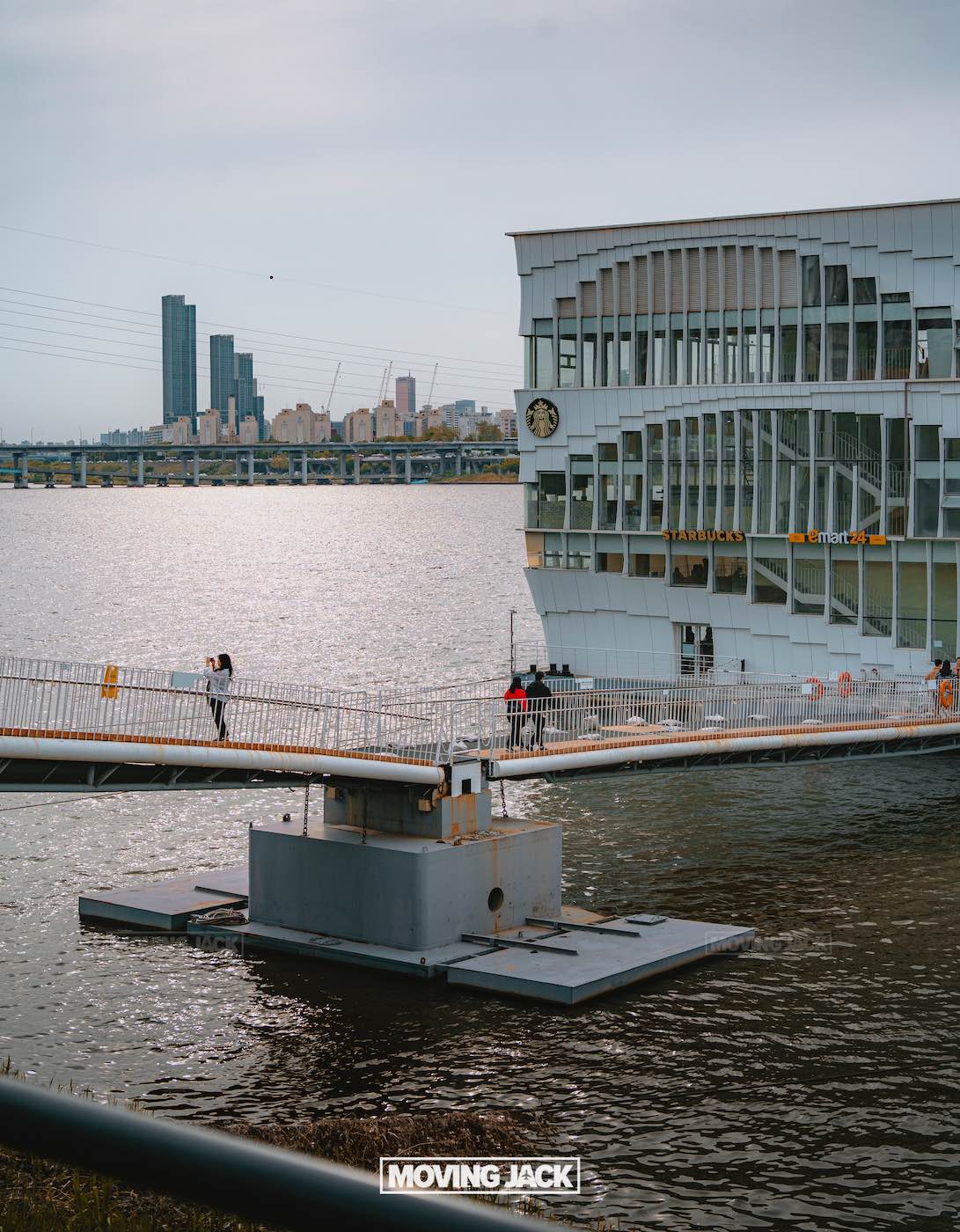 31 best free & cheap things to do in seoul (by an expert) 34 free things to do in seoul A modern riverfront building with a clock is docked by the water, offering one of the best free things to do in seoul. A few people stroll on a gangway bridge connecting to the shore, with the city skyline and bridge visible in the background. -copyright-moving-jack. Com