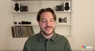 Moving jack 6 moving jack,travel blog A man with brown hair and a short beard smiles while sitting in front of shelves with speakers, cameras, and vinyl records—perfect inspiration for any travel blog. The nbc palm springs logo is visible in the bottom right corner. -copyright-moving-jack. Com